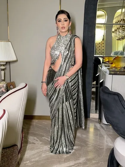 A full-length view of this elegant silver outfit. The makeup was designed to be clean and full glam, creating a look of timeless elegance that is perfect for any special occasion.