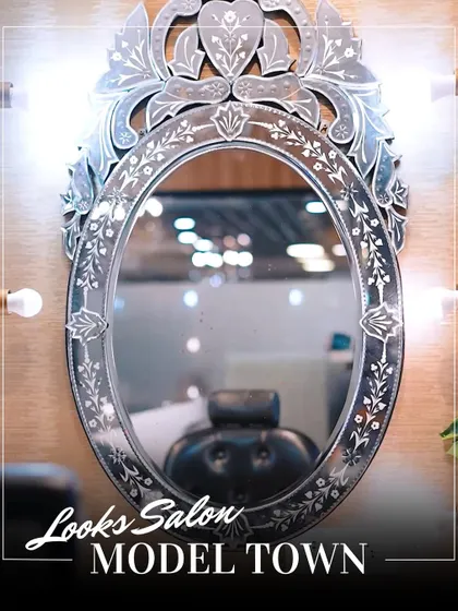 The centerpiece of our makeup station is this beautifully ornate mirror. It's where the magic happens, providing perfect lighting for our artists to craft your flawless look.