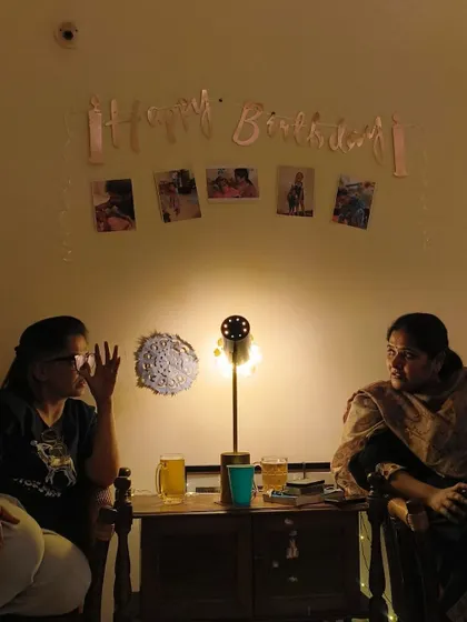 The cozy setup for a birthday celebration, with photos and warm lighting. My performances are designed to fit perfectly into these intimate, personal environments.