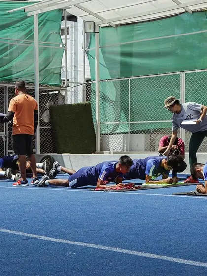 This image shows the Sporting Club Bengaluru team during a core-focused training session on the track. Our partnership has been built on countless hours in the gym and on the field, laying the physical foundation for their success.