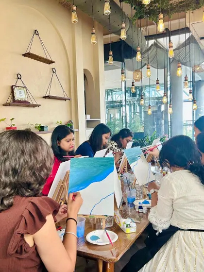 A table of women completely absorbed in their painting. It's a space to unwind, chat, and let your creativity flow.