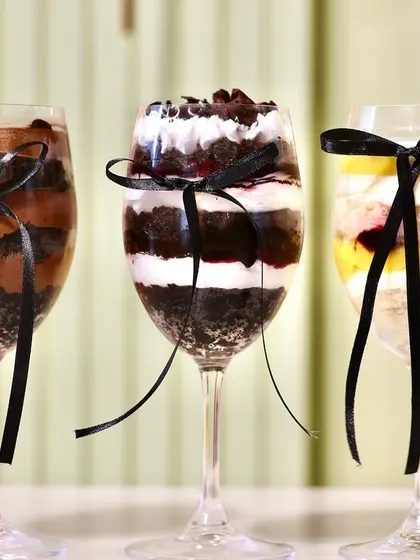 A lineup of our three 'Cake in a Glass' flavors for Father's Day: a rich chocolate, a classic Black Forest, and a fruity lemon blueberry.