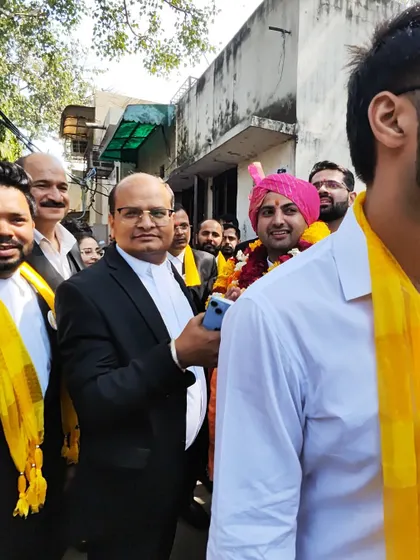 A candid moment from the campaign trail, surrounded by the vibrant energy of my supporters.
