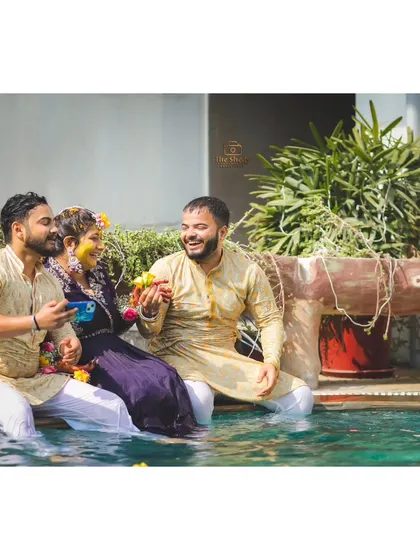 A fun and candid moment with the bride and her friends enjoying the pool party during the Haldi ceremony. These are the memories you'll laugh about for years.