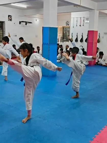 A student executes a high kick.