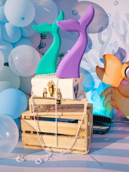 Mermaid tails and treasure chests were just a few of the detailed props we used to bring our 'Under the Sea' theme to life.