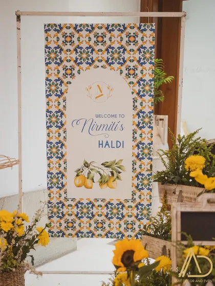 A personalized welcome sign for the Haldi ceremony, featuring a beautiful tile print and lemon motifs that perfectly match the event's theme.