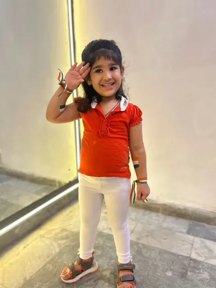Saluting with pride and a big smile. We encourage our kids to celebrate national events with enthusiasm and respect.