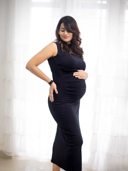 A simple and elegant solo portrait against a bright window, using natural light to create a soft and beautiful image.