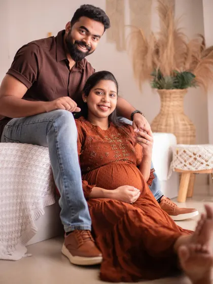 A relaxed and happy portrait in our boho studio. The natural light and comfortable setting help create genuine smiles.