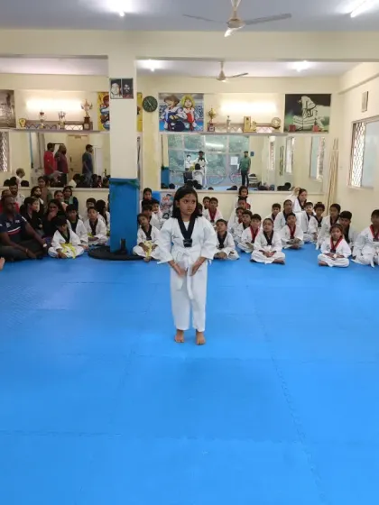 A student stands ready to perform her Poomsae for the belt exam.