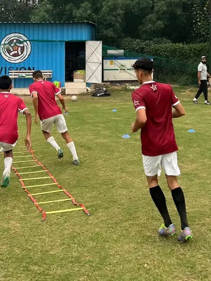 The agility ladder is a fundamental tool for improving footwork and coordination. Here, players work on quick feet drills, a key component of our speed and agility training program.