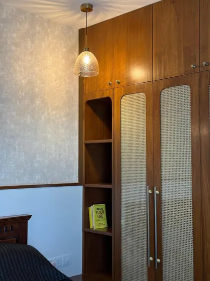 Closet or confidence boost station? This custom teak wood wardrobe with cane paneling and open shelving is both functional and beautiful.