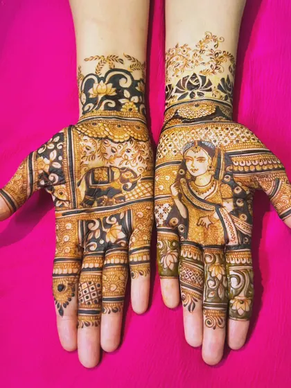 A beautiful bridal design with a portrait on one hand and a decorated elephant on the other, tied together with floral and leaf patterns.