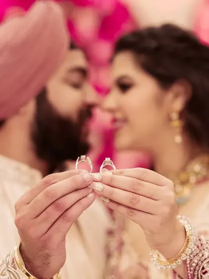 The rings represent a promise. I framed this shot to be intimate and symbolic, focusing on the connection between the couple as they hold the symbols of their commitment. It’s the small details that tell the biggest stories.