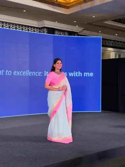 A full-length view of me on the Dockendale stage, embodying the event's theme: "Our commitment to excellence: It starts with me."