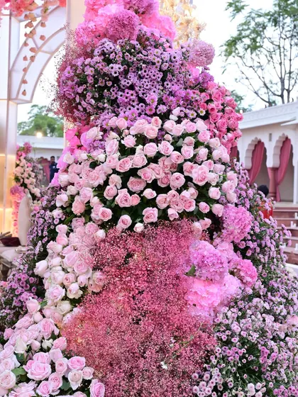 A detailed shot of the floral artistry, showing the rich texture and varied shades of pink from roses, baby's breath, and chrysanthemums that I used to create this masterpiece.