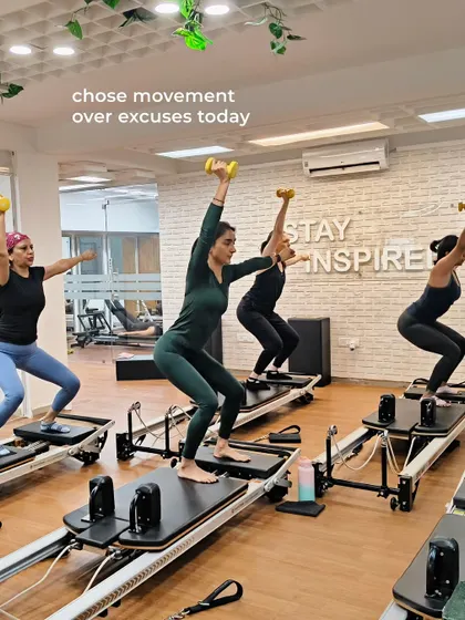 Various shots of members and instructors in action during our dynamic Reformer Pilates classes.