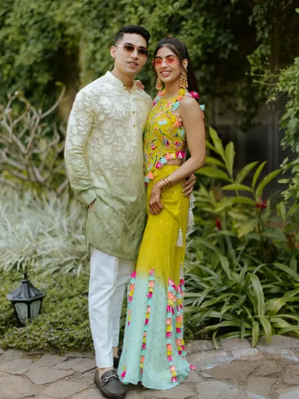 A cool and colorful look for a pool party. The bride's fun outfit is paired with a fresh makeup look and stylish sunglasses.