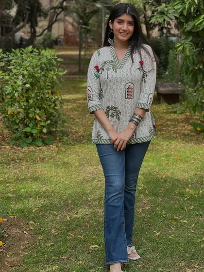 A simple and fresh look for a casual festive gathering. This printed short kurta paired with classic blue jeans is a great example of comfortable and stylish fusion wear.