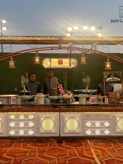 A closer look at our custom-designed buffet station, featuring ornate metalwork and warm lighting. Every detail is crafted to elevate the overall aesthetic of your event.
