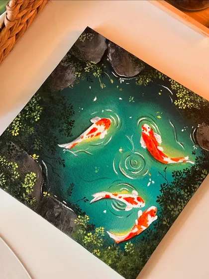 A close up photo of the koi pond painting, focusing on the texture of the canvas and the smooth blending of the acrylics in the water.