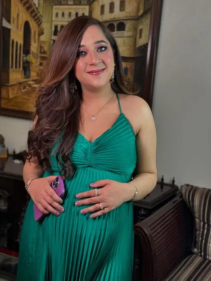 Another beautiful shot of the maternity makeup and hair, capturing her happy and radiant expression.