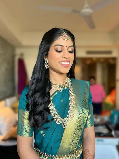 A close-up of the soft, shimmering eye makeup and flawless skin. The look is perfect for a bride who wants to feel glamorous yet natural.