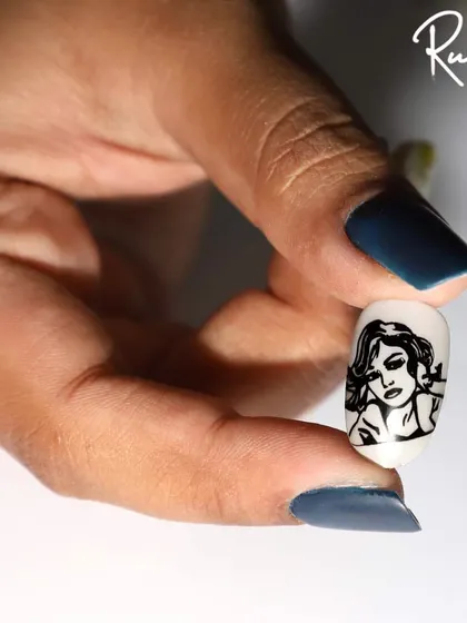 Another example of my stamping art, held by a client with matte navy nails. The contrast is lovely.