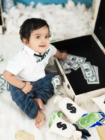 It's all about the money. This overhead shot shows the full Boss Baby setup with prop money and bags, creating a fun scene.