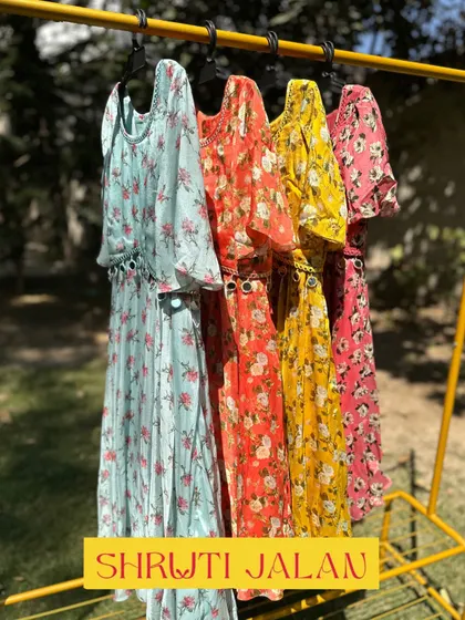 My floral dresses are perfect for little girls who love to feel pretty. This rack shows the dress in four beautiful colors, all made from a flowy, comfortable fabric ideal for summer days.