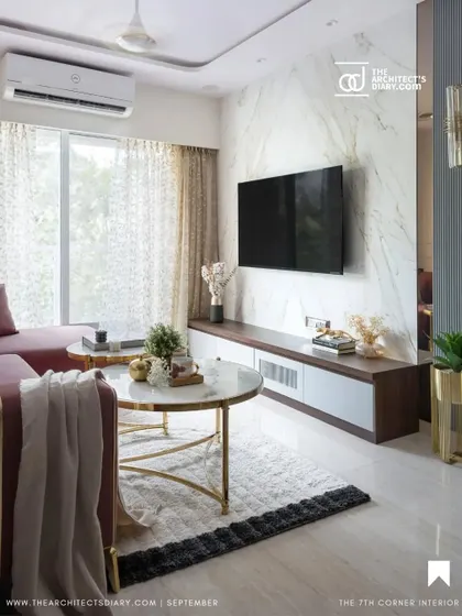 The Architect's Diary featured the living room's TV wall, noting its dramatic marble cladding and clean, modern lines that contribute to the home's sophisticated feel.