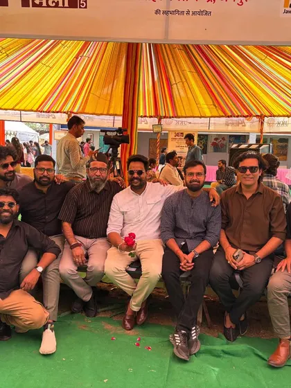 A group of artists taking a moment to connect at the Jaipur Kala Mela.