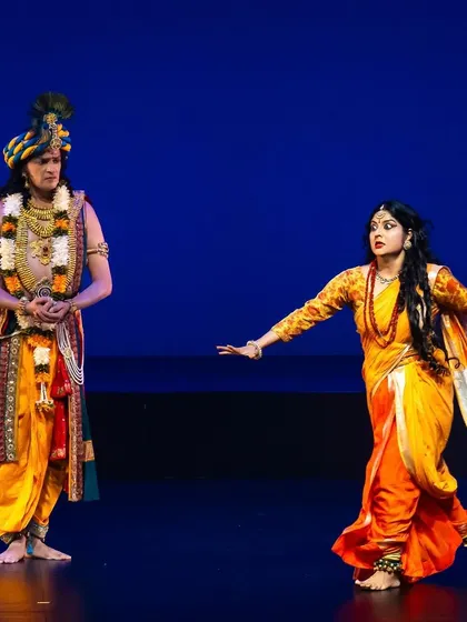 A quiet, expressive moment between two characters on stage. My choreography explores the full range of human emotions, from epic battles to subtle interactions, telling stories that connect with the audience on a deep level.