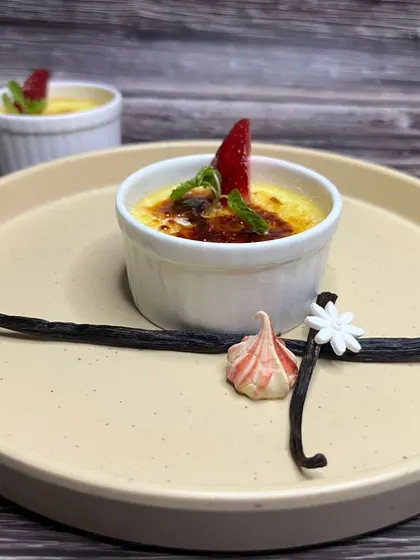 A classic French Crème Brûlée with a perfectly caramelized sugar top. You will learn to make this elegant dessert, including how to use a torch for that signature crackle.