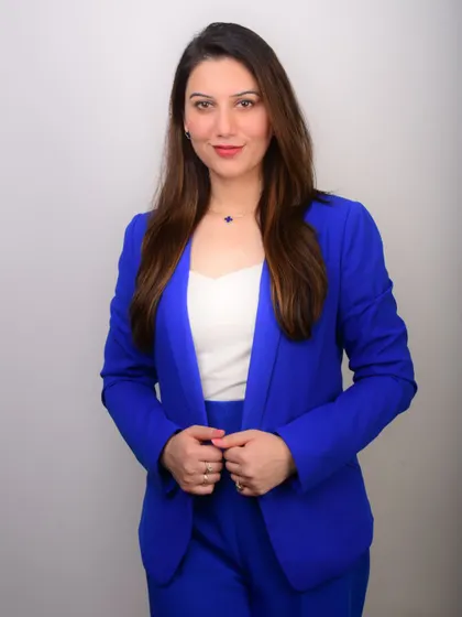 A clean, bright portrait against a white background. This high-key look is modern, fresh, and excellent for use on websites and in publications.