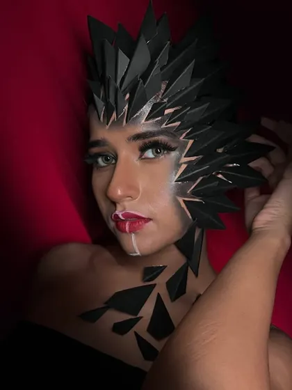 A powerful, direct-to-camera shot that highlights the symmetry and intensity of this fantasy creation.