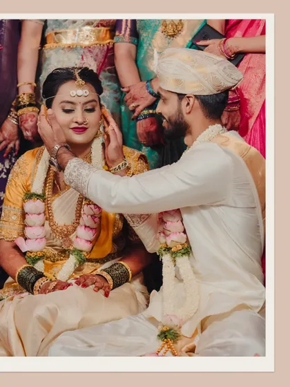 A tender moment where the groom gently touches his bride's cheek. This simple gesture, captured up close, is full of love and emotion.