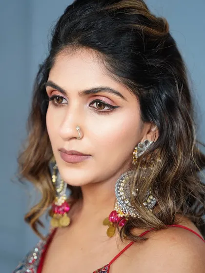 A detailed shot of the Navratri eye makeup. The combination of rose gold shimmer and a sharp wing liner creates a look that is both festive and glamorous.