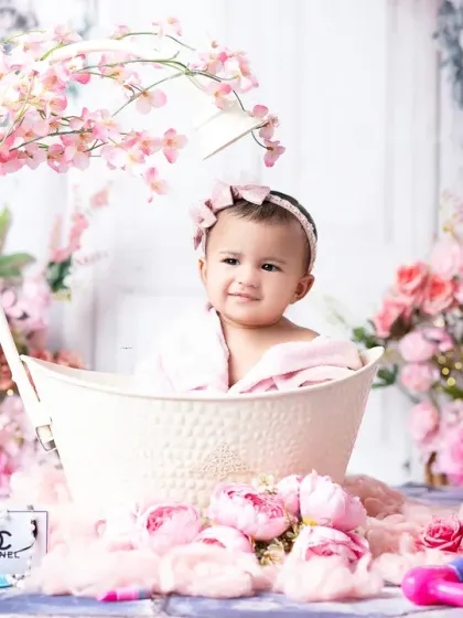 Celebrating six months with an adorable spa-themed sitter session. This little one is all smiles, surrounded by a sea of pink flowers.