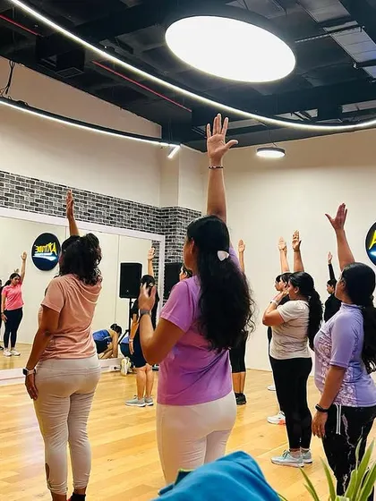 The start of our Zumba class, with everyone raising their hands and bringing amazing energy to the floor. This is what our ZUMBAholics family is all about.