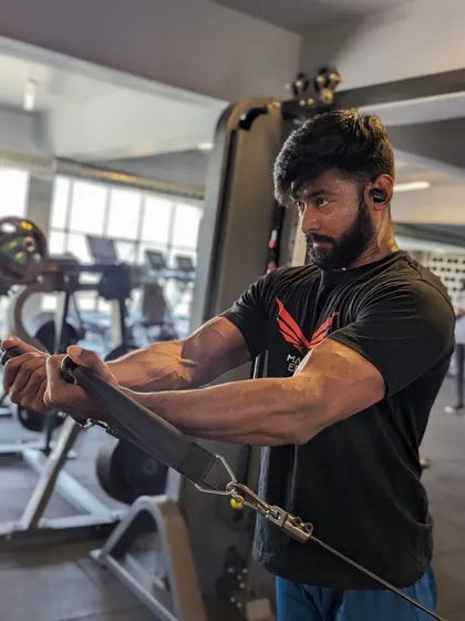 "You are enough, just as you are." A focused shot during a cable workout.
