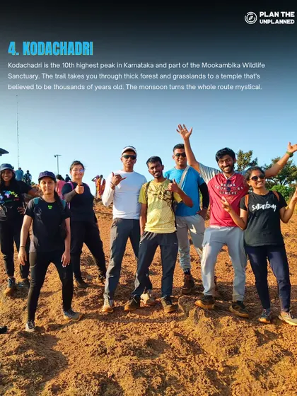 A group of friends celebrating at the top of Kodachadri. This trek is a favorite for its challenging trails and rewarding views.
