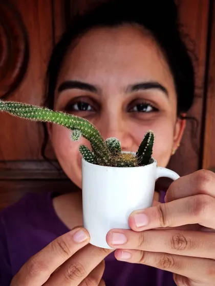 A happy smile with my cactus in a cup. Cacti and succulents are perfect for small spaces and forgetful waterers.