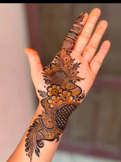 A contemporary design that blends paisley motifs with floral elements and dotted patterns. This is a great choice for someone looking for a unique, non-traditional style.