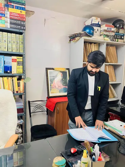 In my office, surrounded by law books and case files. Every successful outcome in court begins with hours of dedicated research and strategy right here at my desk.
