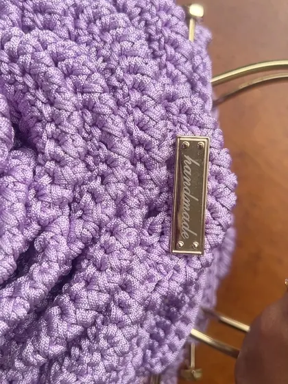 It’s all in the details! This close-up shows the "handmade" metal tag I add to my lavender Rose Bag, a special touch for a special creation.