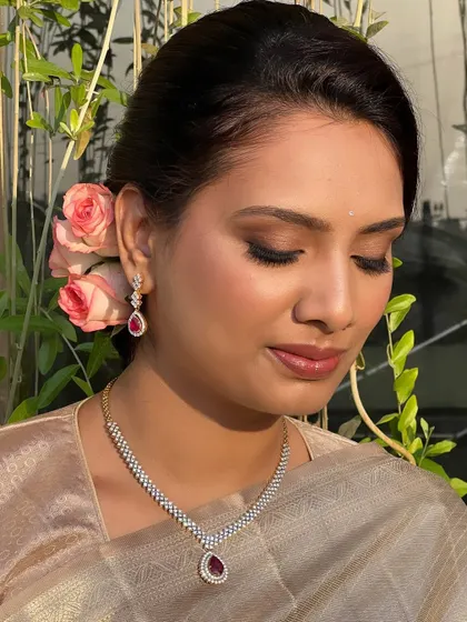 A close-up on the soft, blended eyeshadow and glossy lip. This is a modern and fresh look that you will learn to create for younger clients or daytime events.