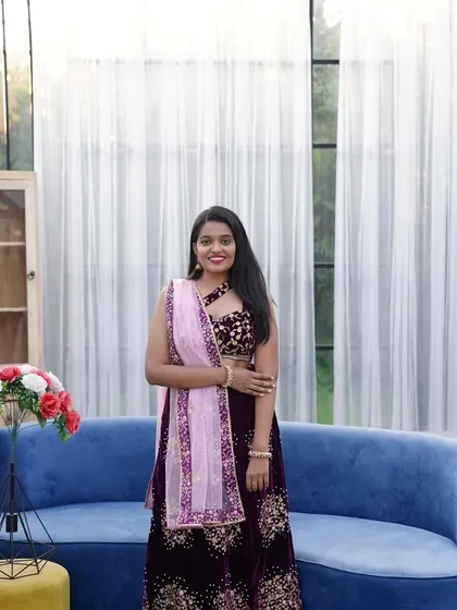 This solo portrait of the bride-to-be in a stunning deep purple and gold embroidered lehenga. This is a great option for engagement parties or pre-wedding events.