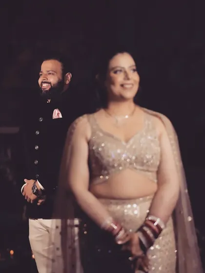 A slightly different angle of the same beautiful moment, showing the groom's happy expression as he looks on.